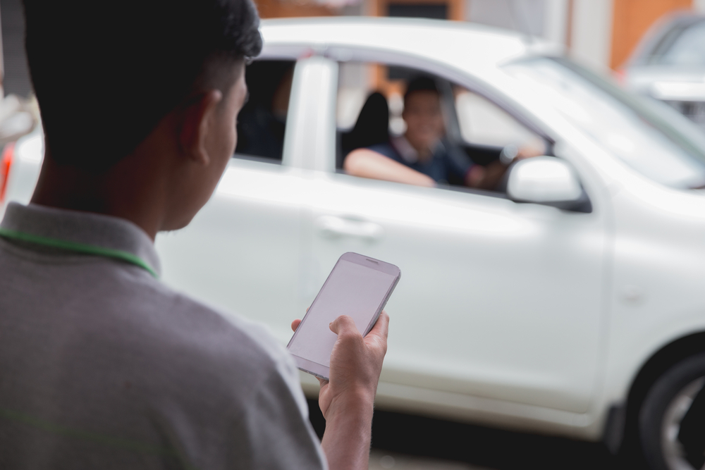 What Can A Rideshare Accident Lawyer Do? - customer ordering taxi via online apps from his mobile phone